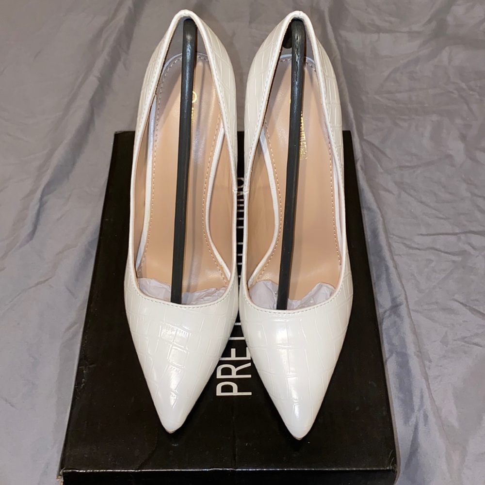PLT White Heels in size 6.